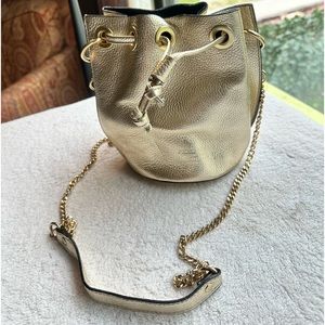 Gold metallic bucket bag with top handle